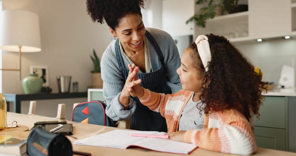 Therapist high fiving child